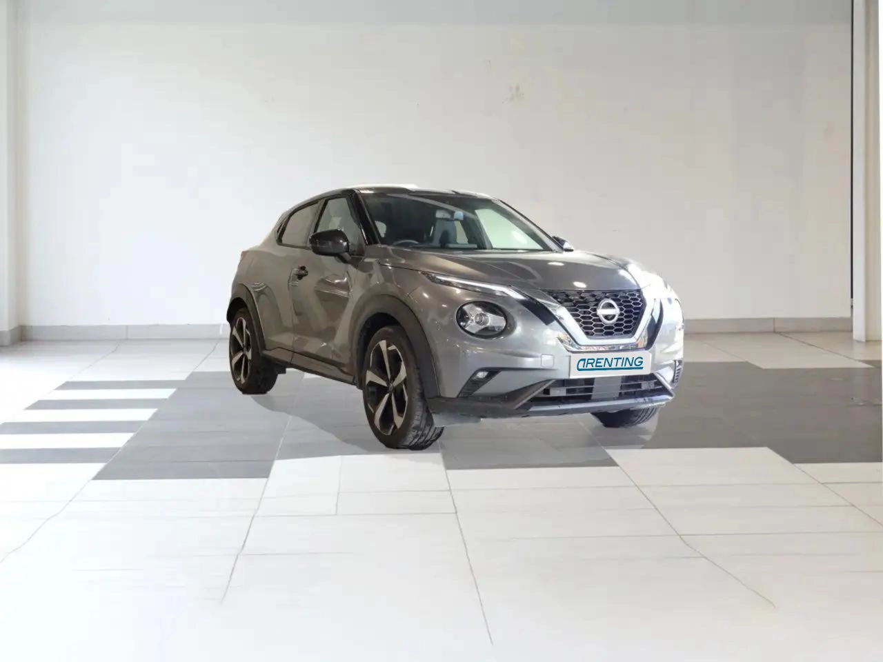 Renting Nissan Juke 1.0 DIG-T Tekna 4×2 114 Gris 1