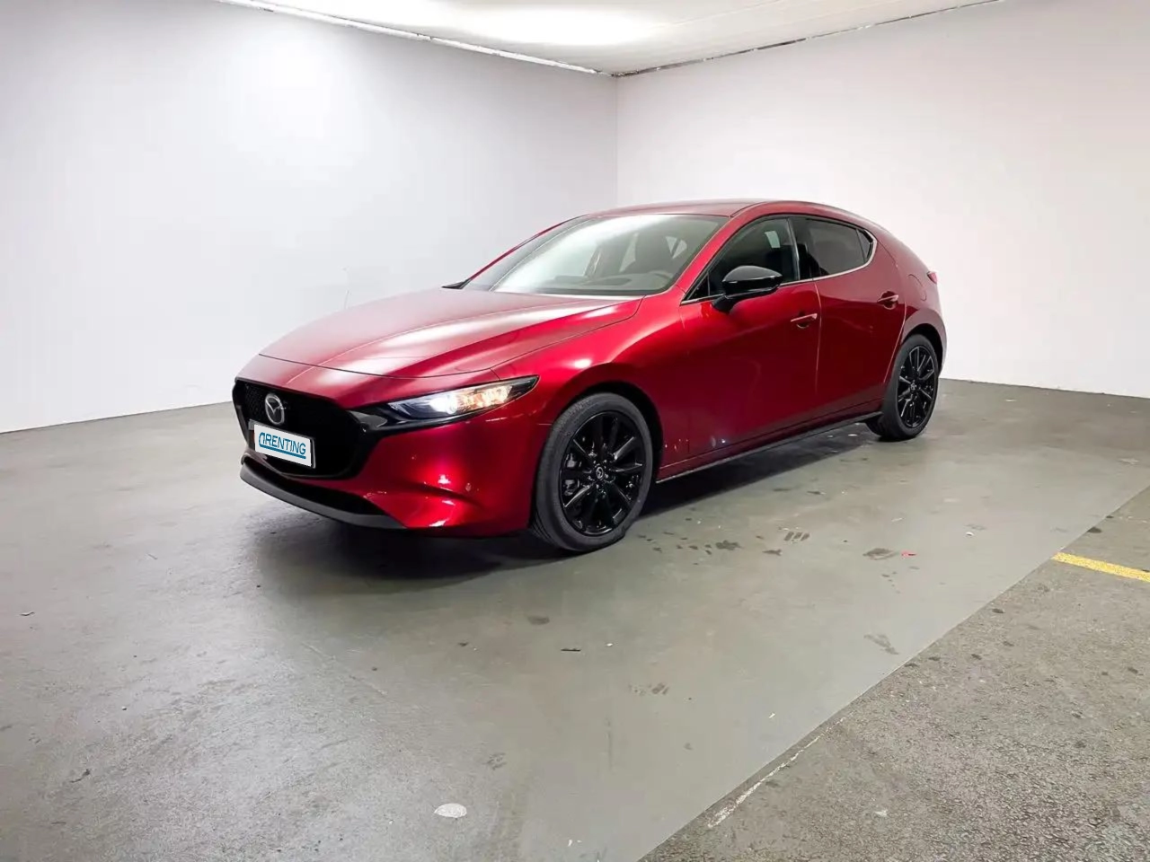 Renting Mazda 3 2.0 e-Skyactiv-G Homura Aut. 110kW Rojo 1